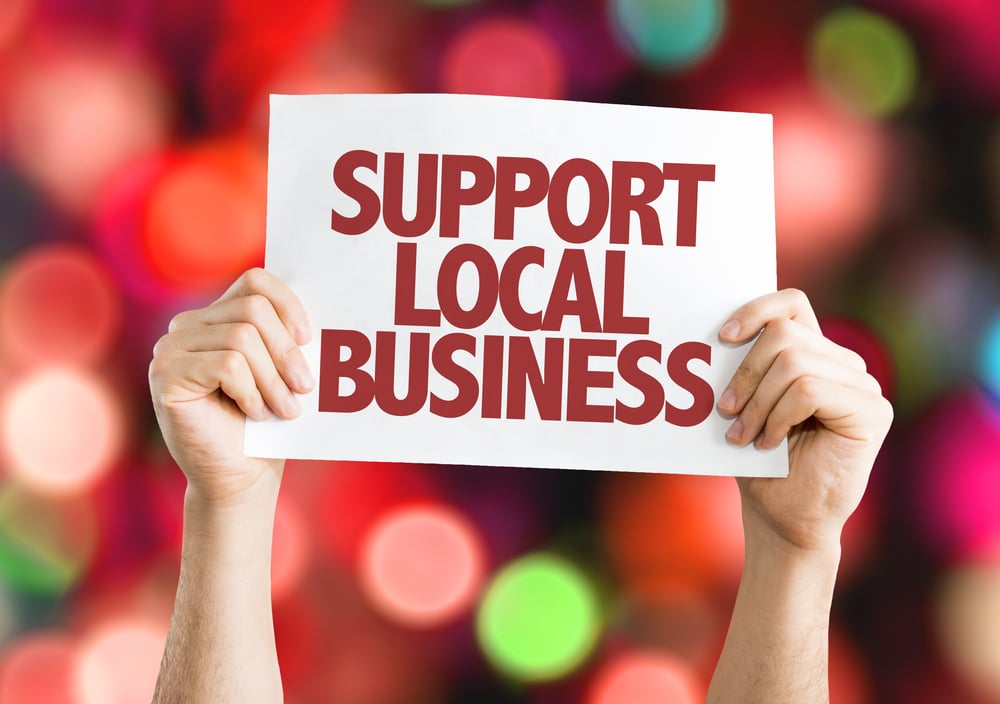 Support Local Business placard with bokeh background