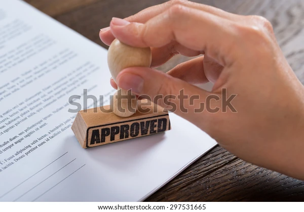 closeup-person-hands-using-stamper-600w-297531665
